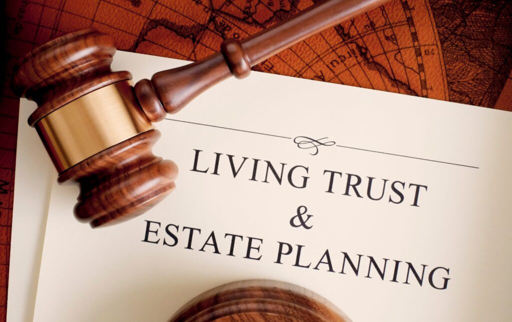 A judges' gavel on living trust and estate planning documents.